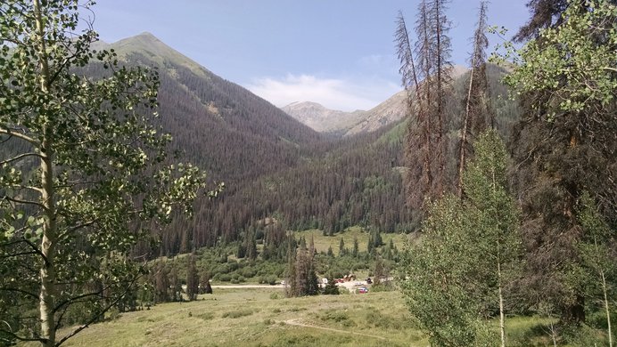 Looking back towards the Silver Creek Trailhead on the way to Redcloud Peak, with the valley below Handies Peak beyond