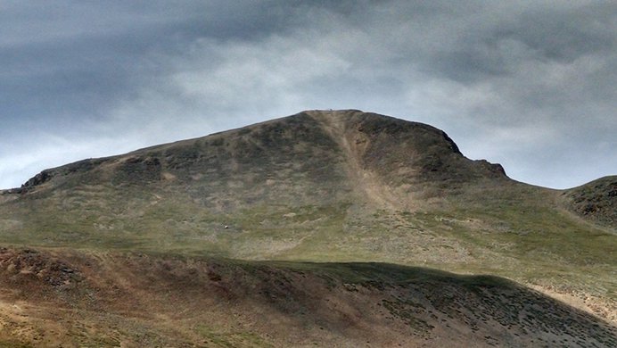 The rounded shoulder of Redcloud Peak