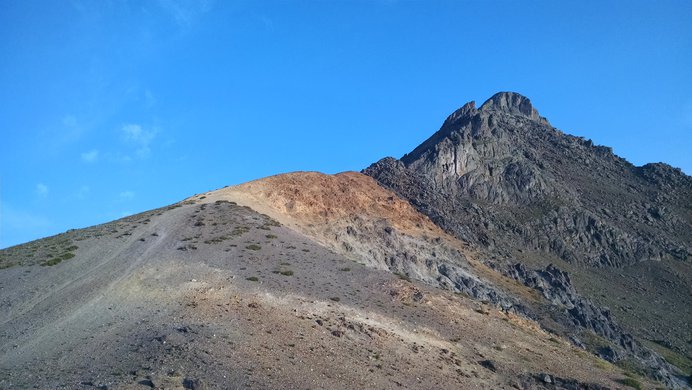 The yellow and gold hill just below the summit block of Wetterhorn Peak