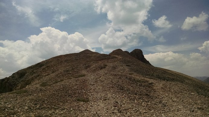 Looking up toward Sunshine Peak during the climb from its saddle with Redcloud