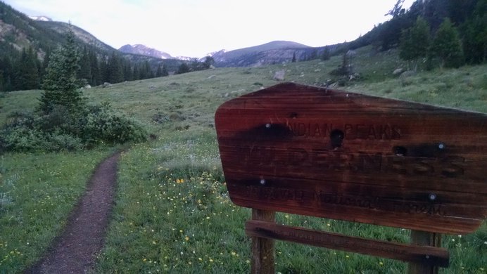 Entrance sign to Indian Peaks Wilderness along the Devils Thumb Trail.